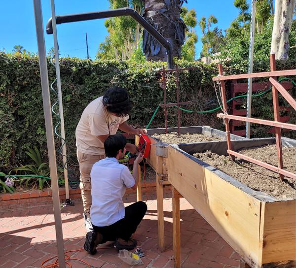 BOOST student Installing gardening project