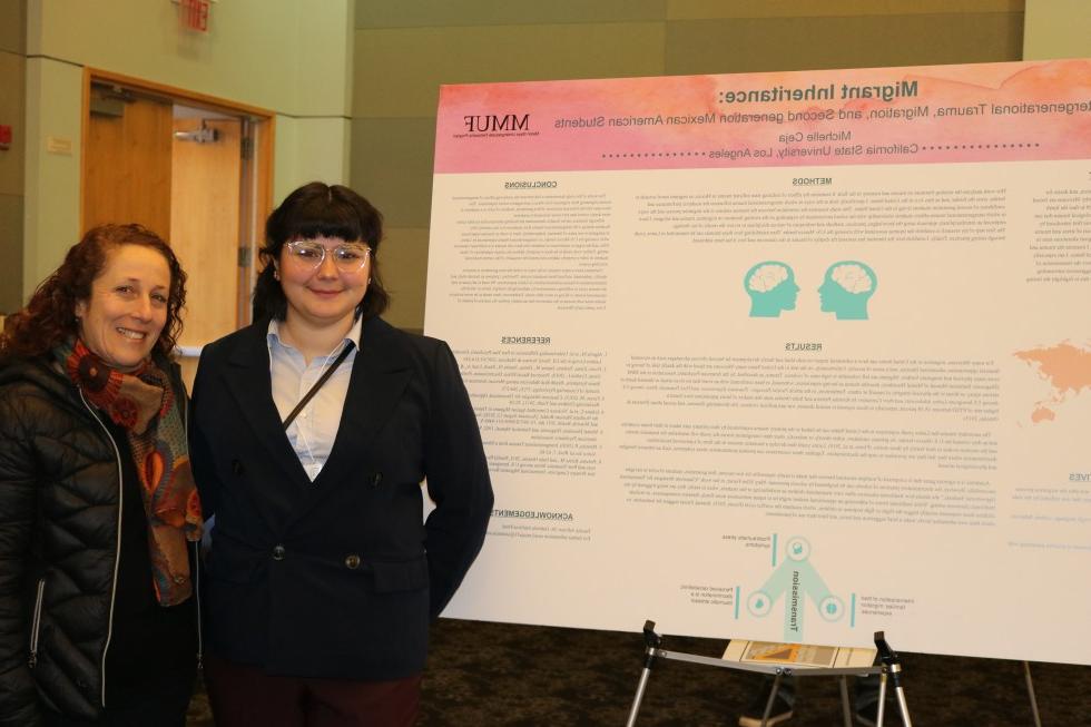 Student and professor in front of posterboard 