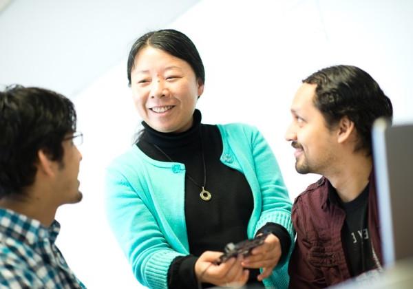 faculty working with two students