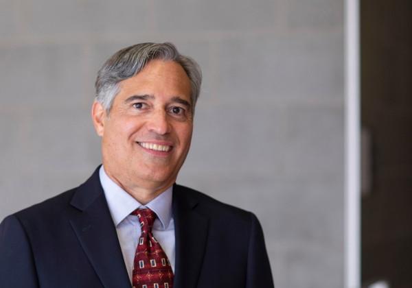 Man with red tie and dark blue suit 