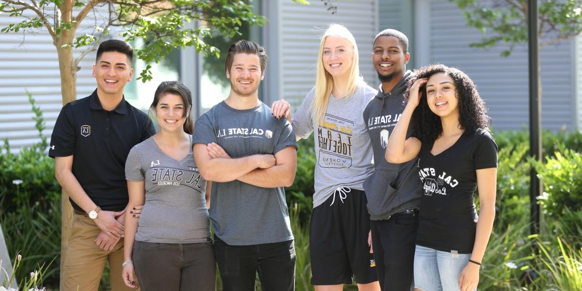 A group of students standing next to each other wearing Cal State LA branded clothing