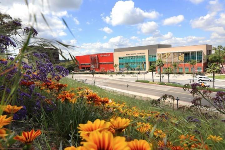 的 University-Student Union building on a sunny day with flowers in the foreground