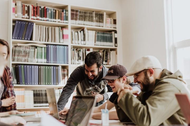 Group of students working together in a library