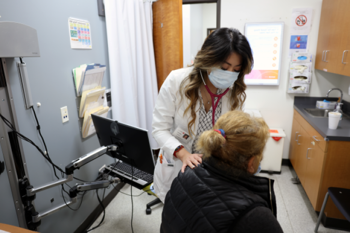 Student helping patient. 