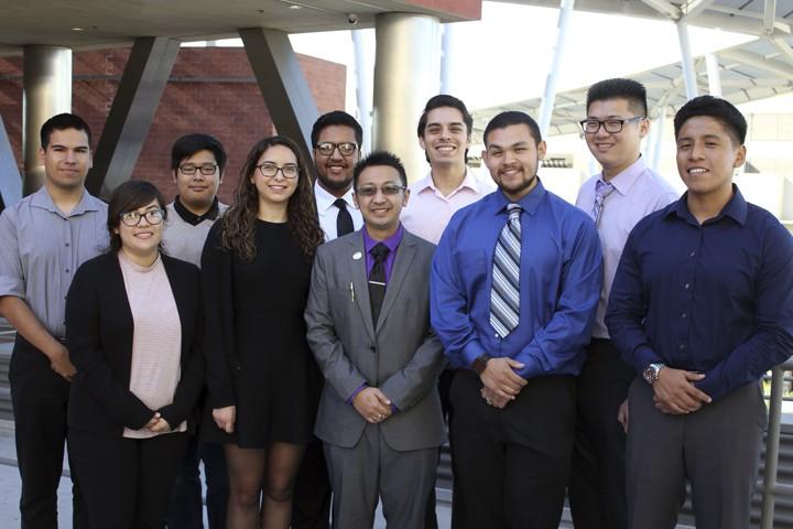 ECST Scholarship winners smile posing outdoors.