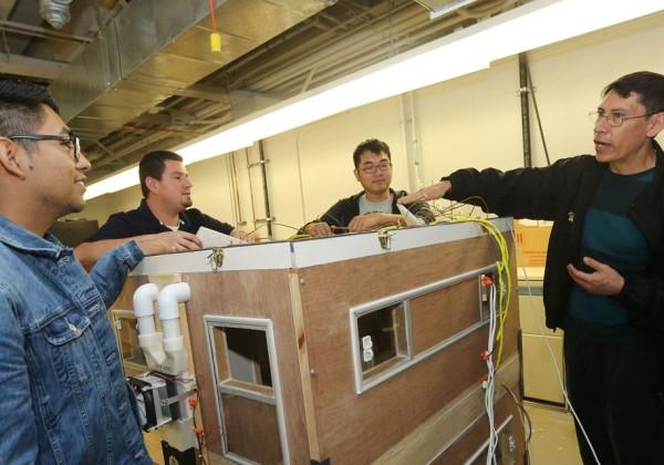 Cal State LA Professor Arturo Pacheco-Vega instructing students in his mechanical engineering class