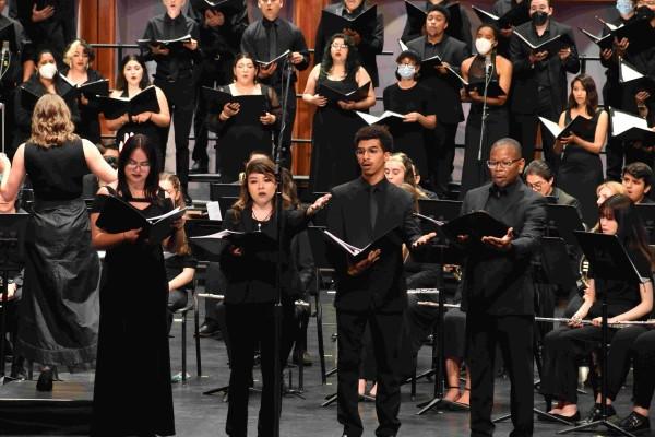 The University Choir and Wind Ensemble conducted by Dr. Emily Moss at the Luckman