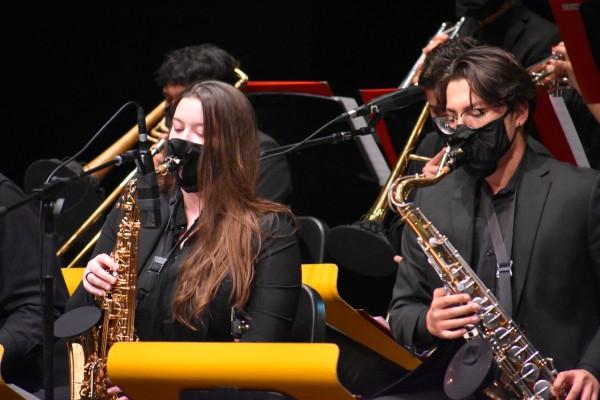 Two students playing saxophone