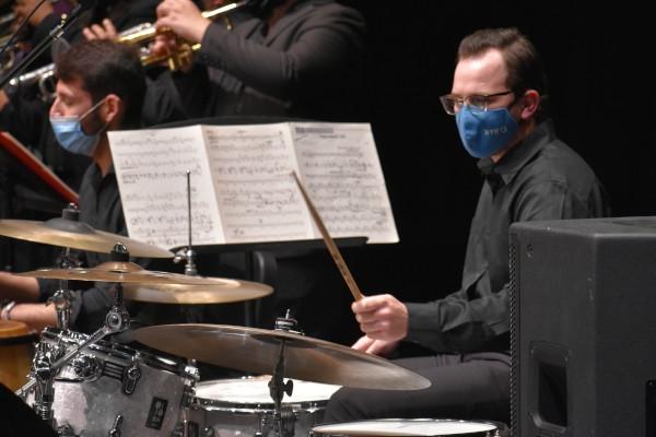 A drumset player playing in Jazz Ensemble