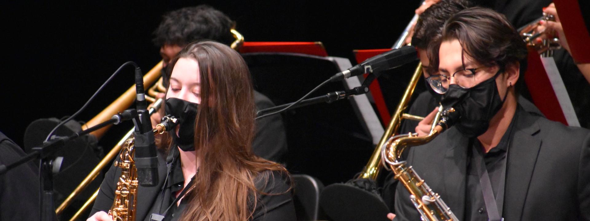 Two students playing saxophone