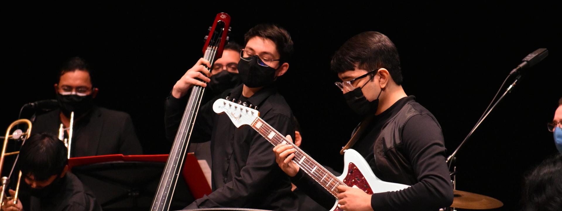 Three students playing in Jazz Big Band